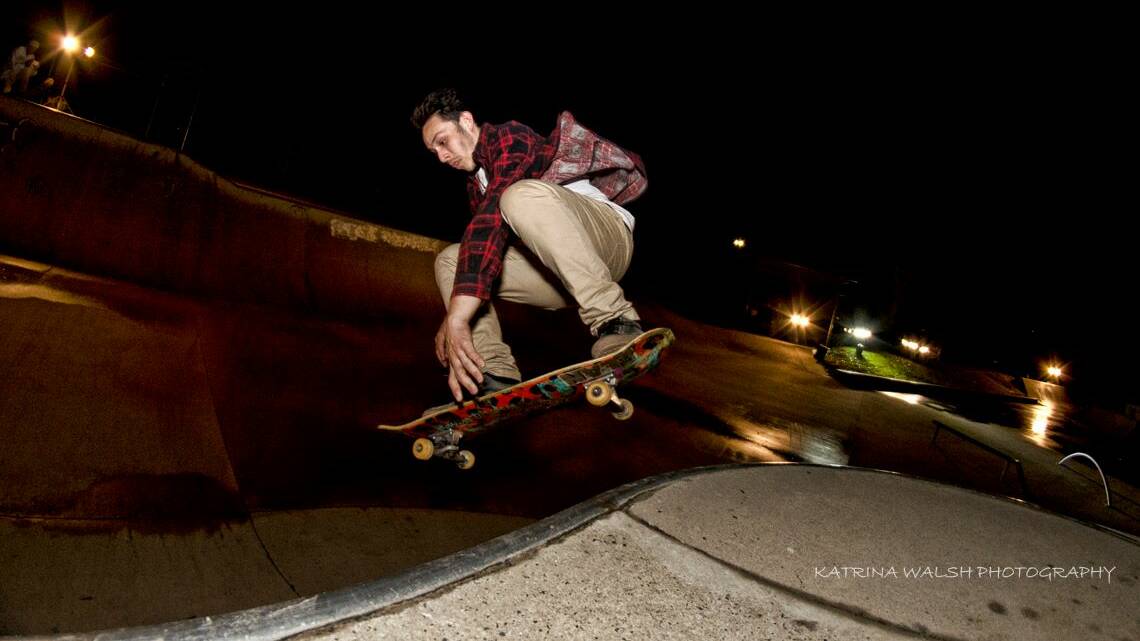 A skater enjoys a night session at the Bega Skatepark on a wet Saturday. Photo: Katrina Walsh.
