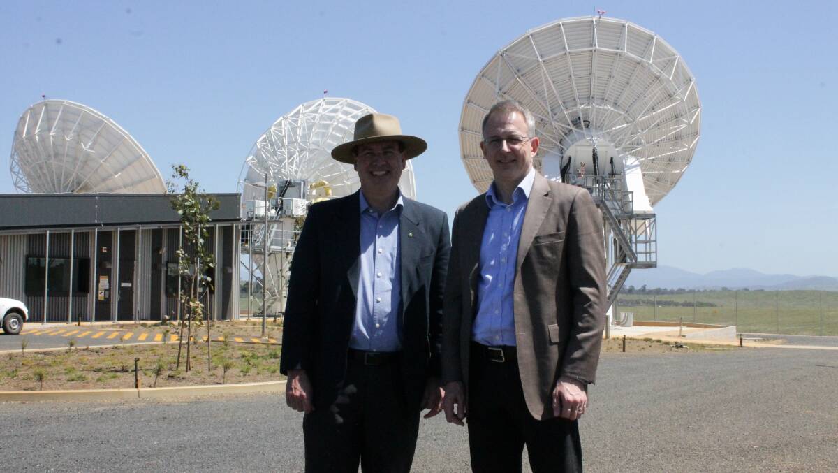 Member for Eden-Monaro Peter Hendy and Parliamentary Secretary to the Minister for Communications Paul Fletcher discuss mobile blackspots in the Bega Valley during a tour of the region on Wednesday. 