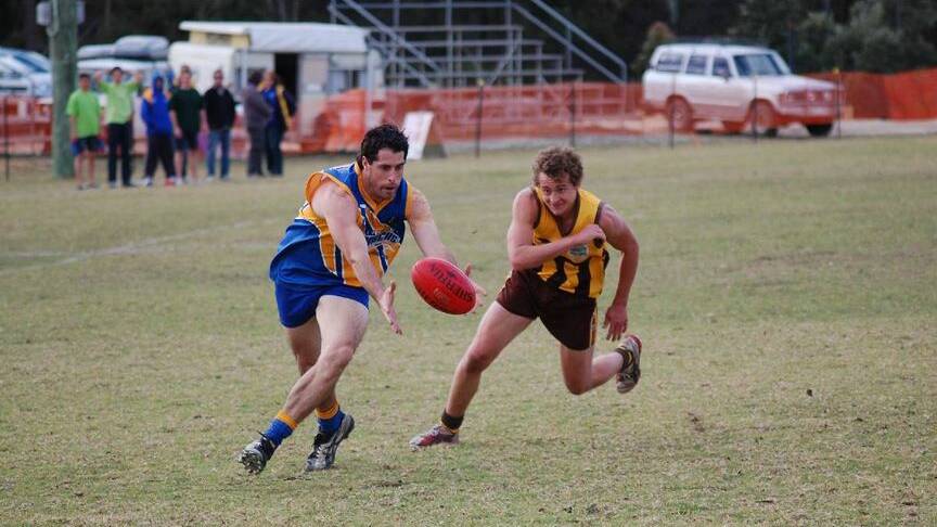 Bermagui's Luke Moresi (left) grabs the ball in a past match.