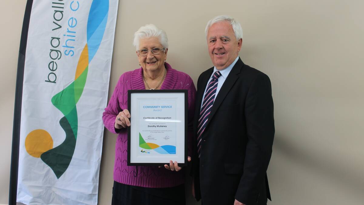 Dorothy Mullaney is congratulated by Mayor Bill Taylor upon receiving a Bega Valley Shire Community Medallion. 