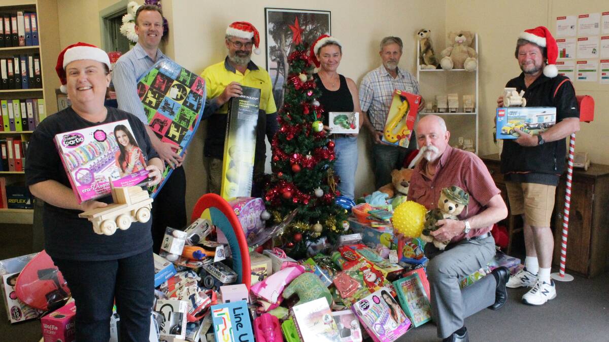 Celebrating the success of the inaugural Bega District News Christmas Toy Drive are (from left) Lesley Newton from the Bega Salvation Army, BDN editor Ben Smyth, Stewart Tyrrell from the Bega Lions, Ulysses Sapphire Coast president Kate Spears, Bega Rotary president Charlie Blomfield, BDN features coordinator Gary Etcell and Tony Hergenhan from St Vincent de Paul Bega. 