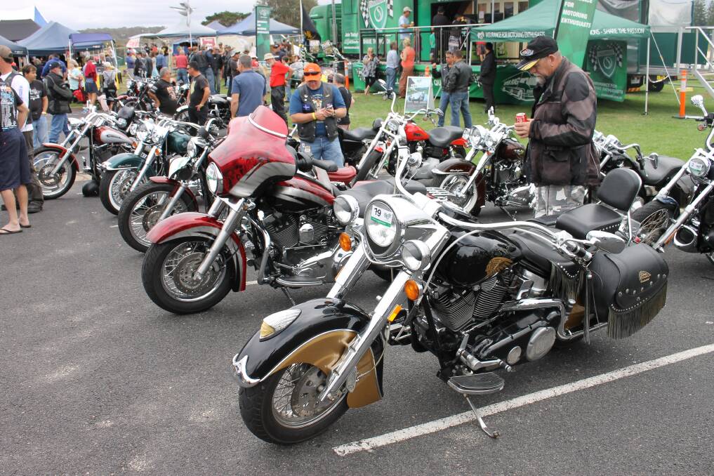 Bermagui Bike Show 2014 visitors admire the many bikes on display. 