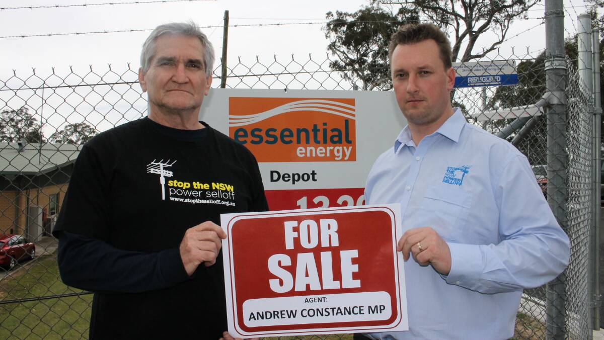 Electrical Trade Union secretary Steve Butler (left) with Stop the Selloff campaigner Paul Lister at the Bega Essential Energy depo.