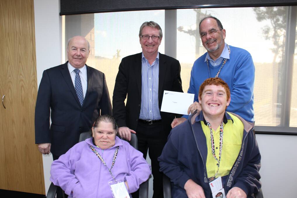 Presenting a cheque for $100,000 to Tulgeen Group is (back, from left) Bega Cheese CEO Aidan Coleman, executive chairman Barry Irvin, CEO of Tulgeen Group Pete Gorton, and (front) Annie Russell and Cornelius “Corny” Moon from Tulgeen.