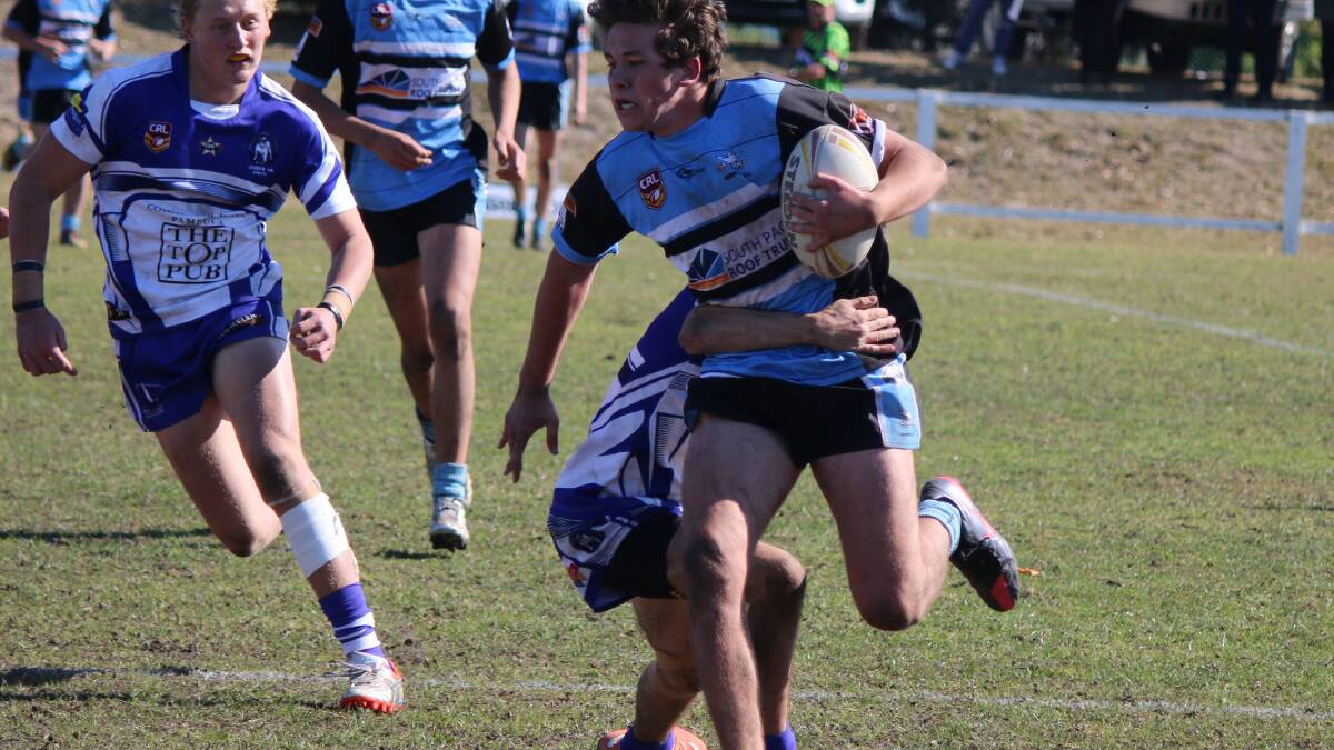 HIT-UP: Moruya Sharks under 18s player Dakota Feirer runs through a tackle against Merimbula-Pambula-Eden-CBU combined team on Sunday. The under 18s are one of the three Moruya teams to qualify for Group 16’s grand final day at Bega Recreation Ground this Sunday. Photo: JACOB McMASTER.  