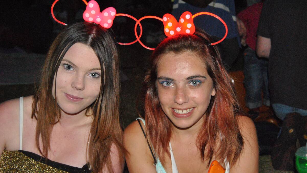 ULLADULLA: Glowing red Mickey Mouse ears were the must-have fashion accessory for Brittanie Bailey and Mindie Bailie-Mills of Ulladulla. 