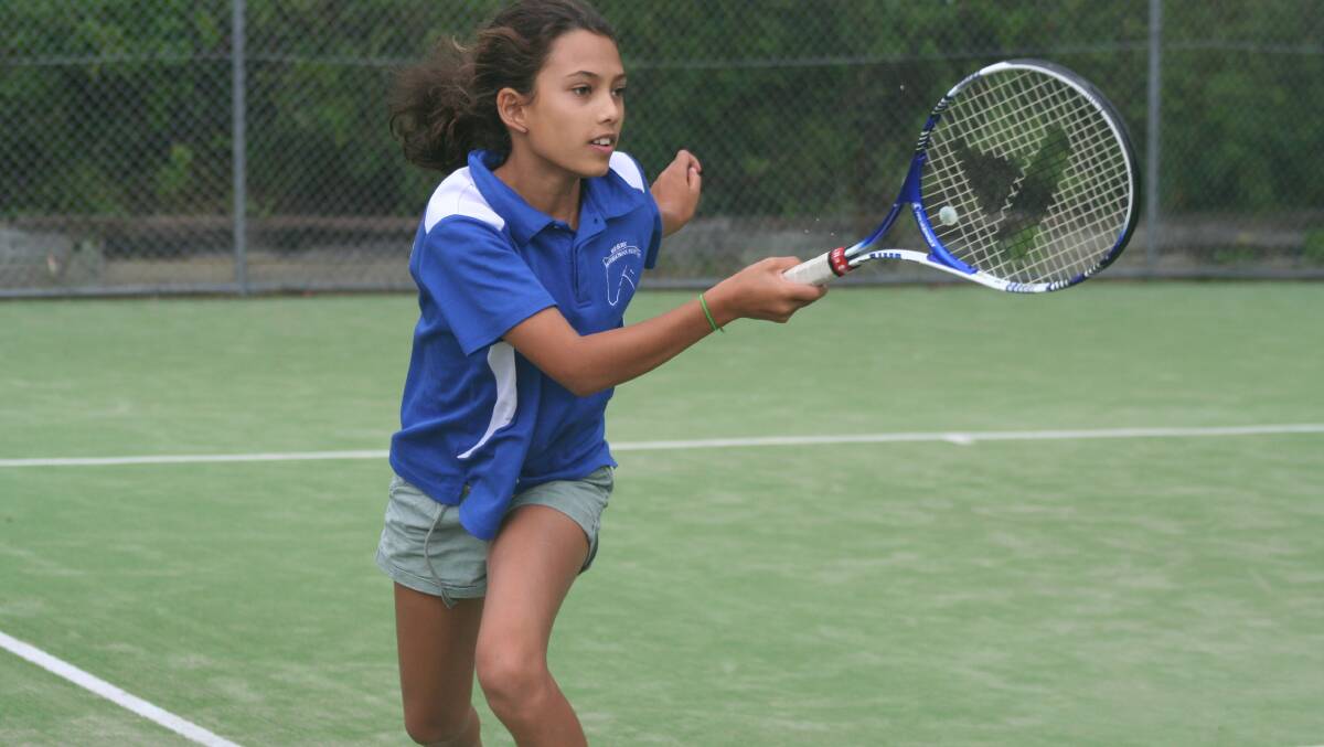 ULLADULLA: Ella Simon swings a forehand on the run during the weekend’s junior tennis competition.  