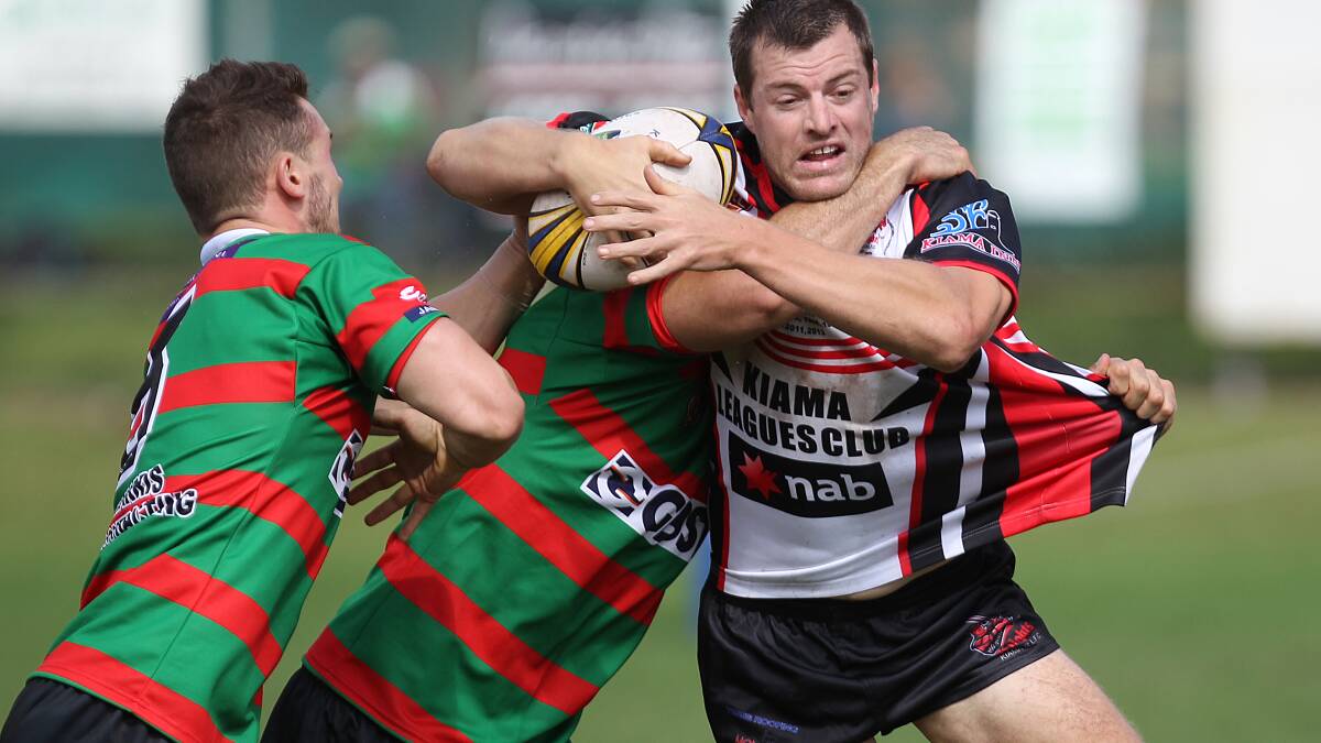 KIAMA: Kiama Knights co-captain Cameron Whittaker tries to get a pass away despite the attentions of two Jamberoo defenders on Saturday. Picture: DAVID HALL 
