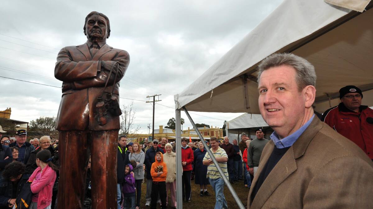 NSW Premier Barry O'Farrell unveils the bronze statue of Ray Warren in Junee in 2011. Picture: Michael Frogley/The Daily Advertiser