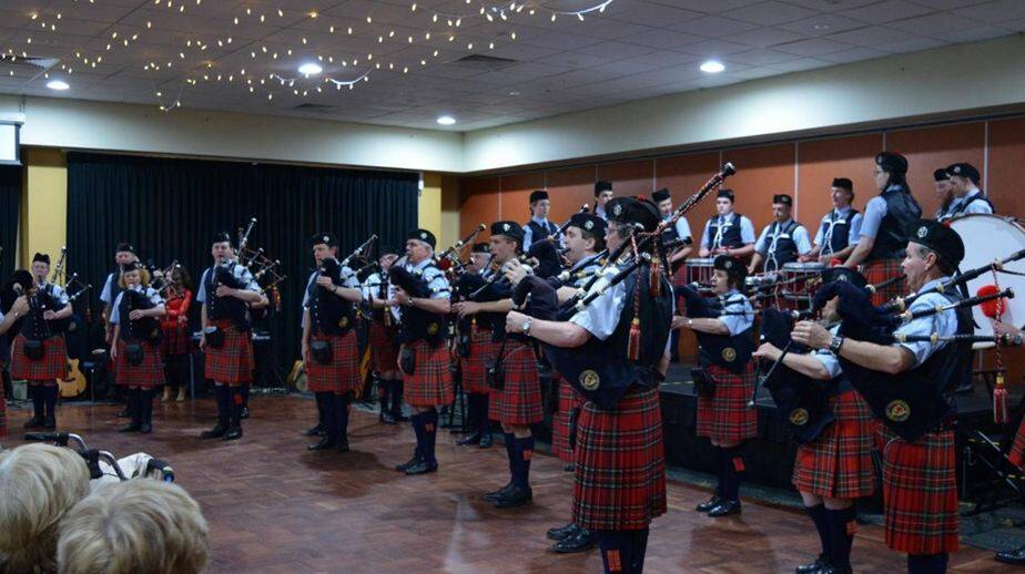 The Canberra Burns Club Pipe Band performing at the Merimbula RSL.