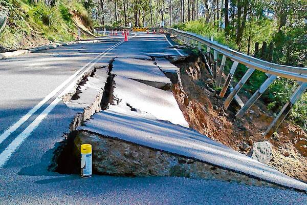 •  A section of the Snowy Mountains Hwy on Brown Mountain shows extensive damage caused by a landslide during last week’s heavy rain.