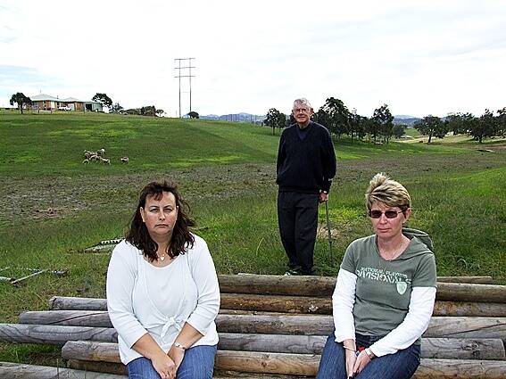 • Elaine Cole, Jenelle Loftus and Ewan Munro are concerned about the Country Energy upgrade that will run through the development on Max Slater Drive.