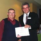 Bega TAFE campus accounting procedures outstanding achievement student and former teacher Bertrand Irons receives his award from the Illawarra TAFE manager of district operations, David Bisiker.
