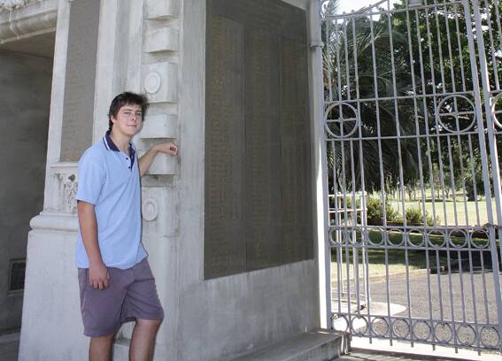 • Nathan Barnden at the Bega Soldiers’ Memorial which bears the names of two of his relatives.