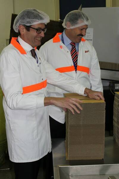 Minister for Climate Change and Energy Efficiency Greg Combet tours the Bega Cheese factory floor with Member for Eden-Monaro Mike Kelly.