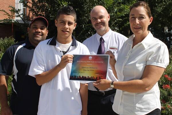 Bega High School Indigenous support officer Mark Rose (left) and acting principal Ian Moorehead show their pride as Housing NSW senior client officer Katrina Evans presents Year 11 student Marcus Mundy with a $2000 youth scholarship.