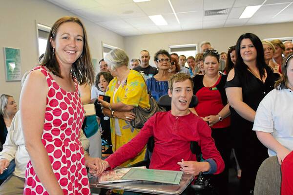 • WorkAbility manager Karen Butchers with Nathan Johnston at the opening of WorkAbility House.
