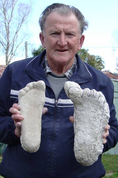 Rex 'Yowie Man' Gilroy holds a cast of his own right foot and that of an opposable big-toed left foot of a “yowie” for physical comparison. Mr Gilroy is planning to conduct a search around Bega for more evidence of the creatures from Australian folklore.