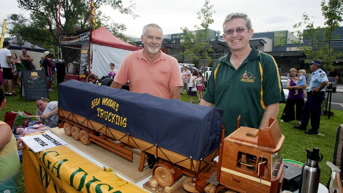 Peter Langham and Paul Healey of the Bega “Woodies” show off the major prize in the group’s raffle.