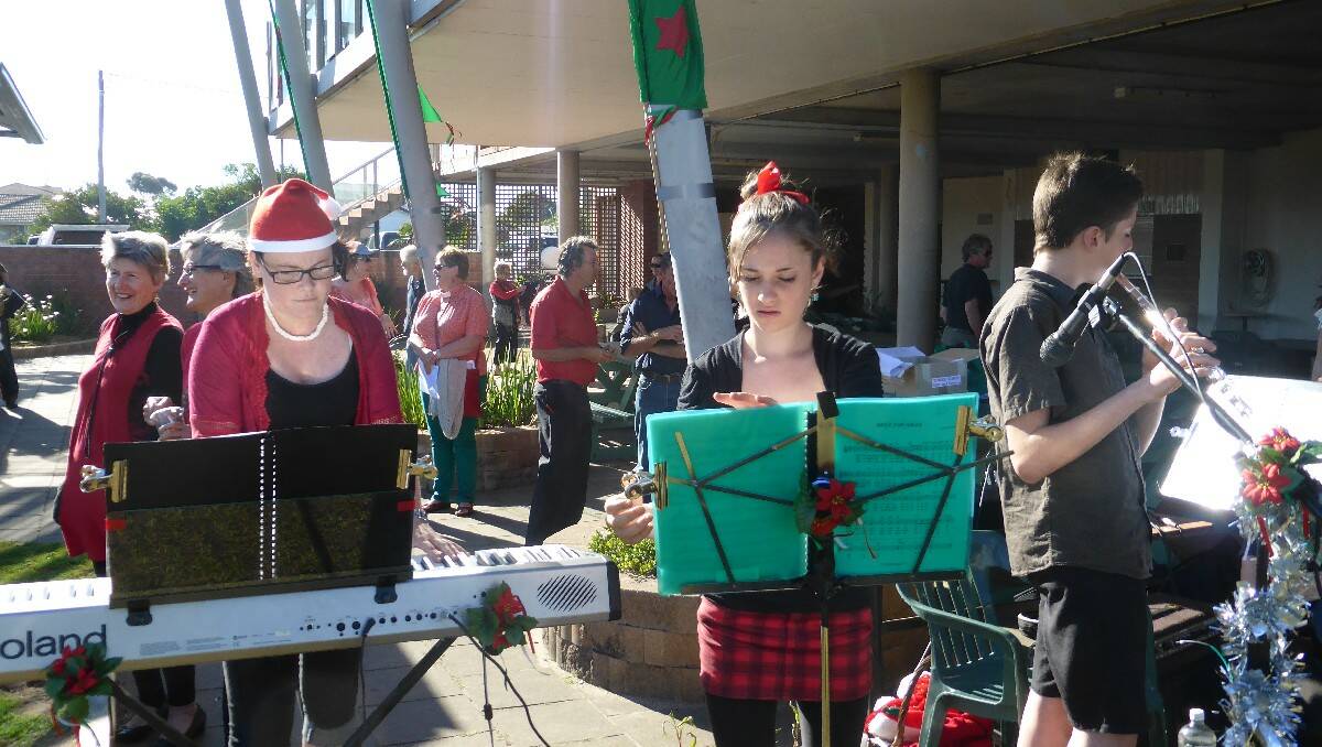 Warming up to provide the entertainment are (from left) music organiser Jaclyn Sloane on keyboard, Olivia Buchli on violin and Elijah Buchli on flute. 
