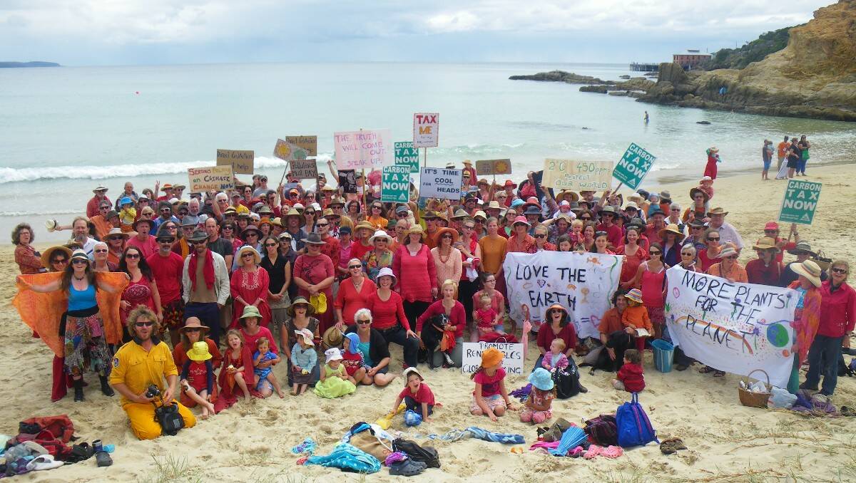 The National Day of Climate Action attracted a large group of supporters to Tathra Beach on Sunday. Photograph by Pip Cullen. 