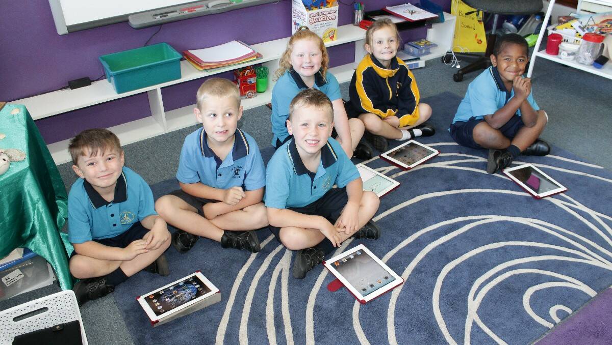 Practising their iPad skills are St Patrick's Primary School Kindergarten pupils (from left) Marcus Ward-Lichtenberg, Blake Bateman, Jake Smith, Georgina Whitby, Ruby Hoskins and Joseph Gauniqio.