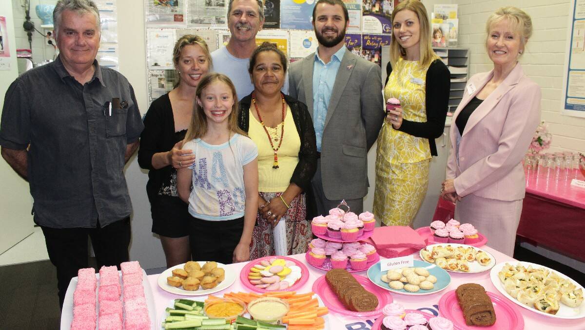 Celebrating the Cancer Council Bega office’s second birthday are (from left) Russell Cook, Donna Wade, Gjumurrah Moore, Graham Moore, Sharon Perry, Toby Dawson, Mia Parsons and Ann Mawhinney.