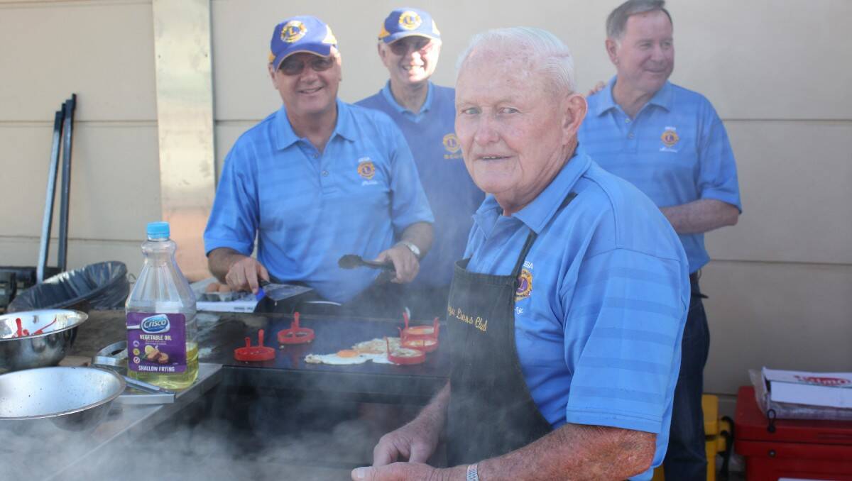 Bega Lions Club members manning the free barbecue breakfast are (from left) Ross Suter, Phil Benny, Denny Wiley and Mike Gowing.