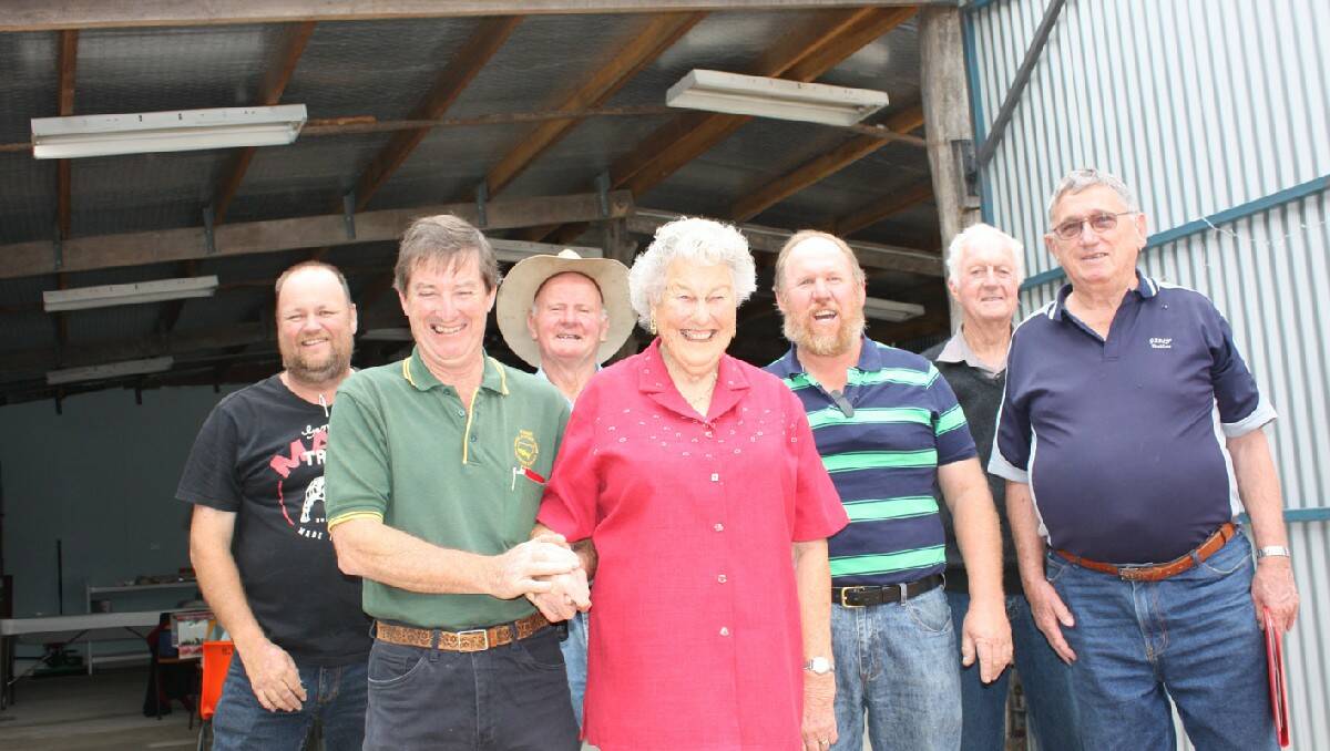 Celebrating the official opening of the Bega and District Historical Machinery Club’s new shed are (from left) Glenn Ubrihien, Rick Jennings, Bill Quinn, Nita Quinn, Phill Targett, John Cooper and Peter Caragher.