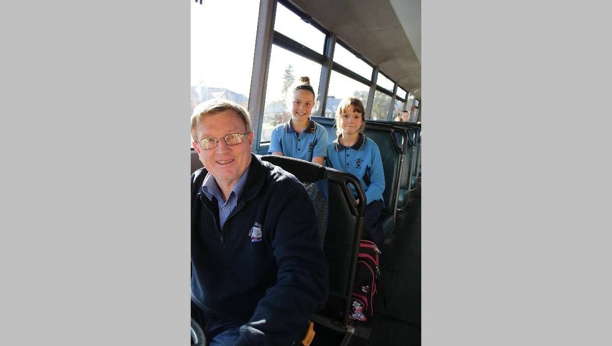 Local bus drivers and school students, including (from left) Robert Jeffery and Saint Patrick’s School pupils Alice and Cynthia Stewart, are welcoming the announcement that seatbelts will be installed in school buses.