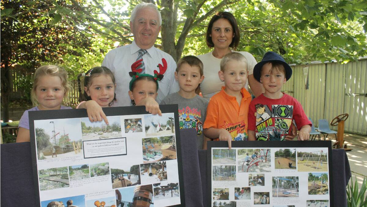 Mayor Bill Taylor is shown plans for Littleton Gardens by Bega Preschool’s (from left) Ashleigh Whyman, Laura Slater, Payton Alcock, Jaxson Dibley, teacher Annastasia Norris, Blake Bateman and Jack Gauci.