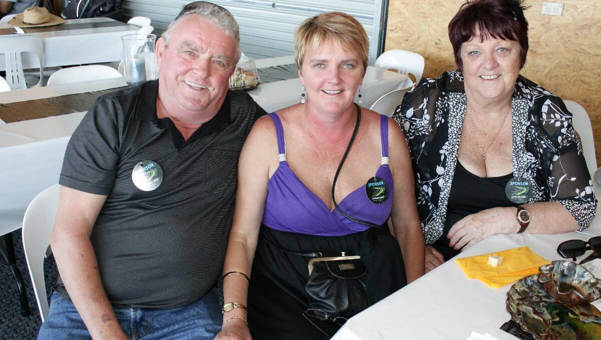 Bega’s Tracy Beesley (centre) celebrates her Melbourne Cup winning bet with Ray and Pauline Wozniak, of Brisbane.