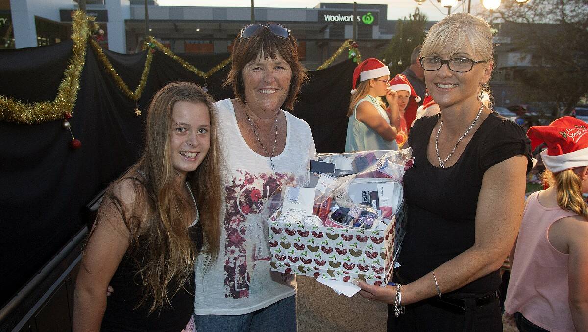 Nakayla Rootsey and prize winner Vicki Hanscombe are congratulated by sponsor Jodie Heaton from Priceline Bega.