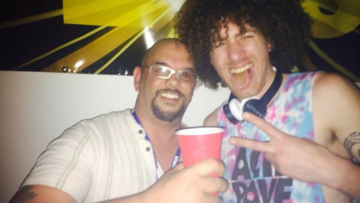 Event organiser Starr Kopa (left) enjoys a drink with DJ Elecfro.