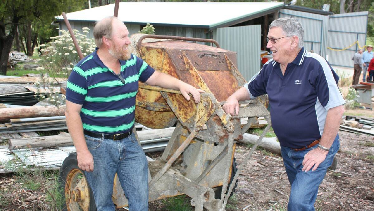 Feeling pretty pleased with their new clubhouse are Bega and District Historical Machinery Club shed committee president Phill Targett and club president Peter Caragher.
