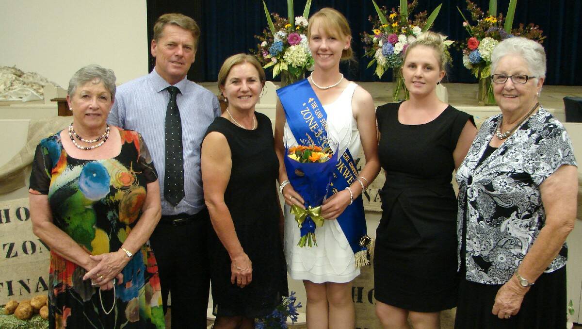 Congratulating Brodie Chester (middle) on being named Zone 3 Showgirl are (from left) Barbara Ubrihien, Norm Pearce, Narelle Pearce, Jacinta Day and Marie Smith at Crookwell on Saturday night.
