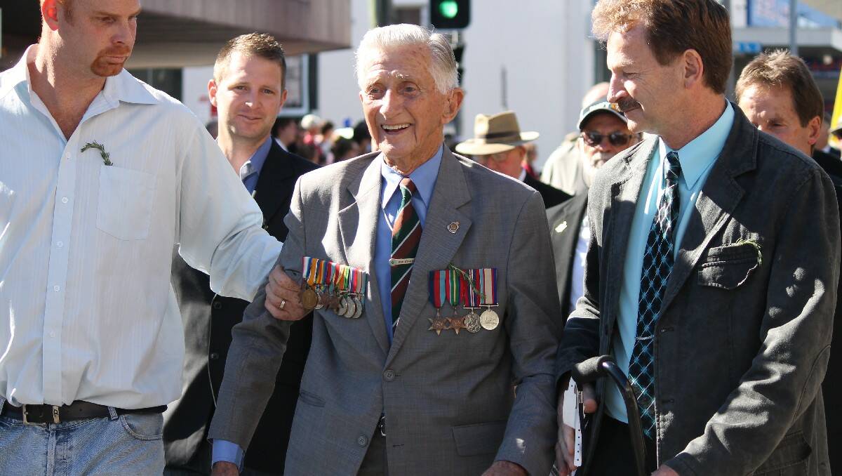 Ronald Stanton marches with family during yesterday’s Anzac Day service in Bega.