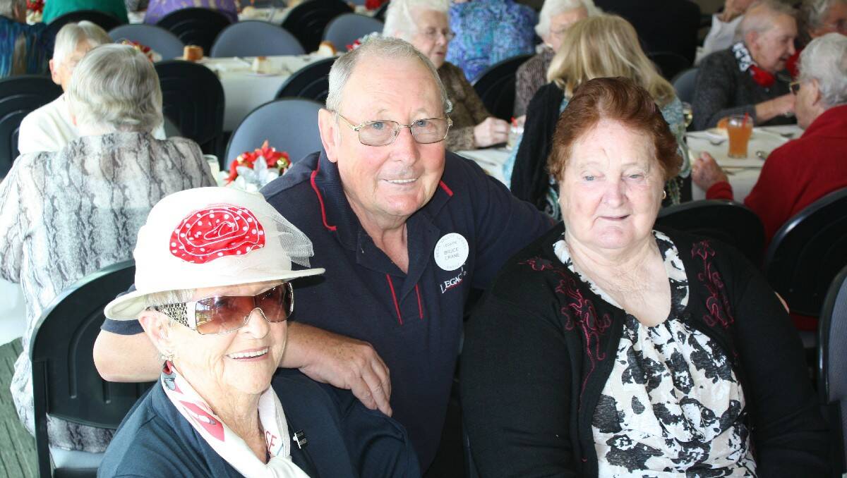 Bega Valley Legacy chairman Bruce Crane chats with Mavis Wheeler and Gwen Goward at Friday’s Christmas lunch.