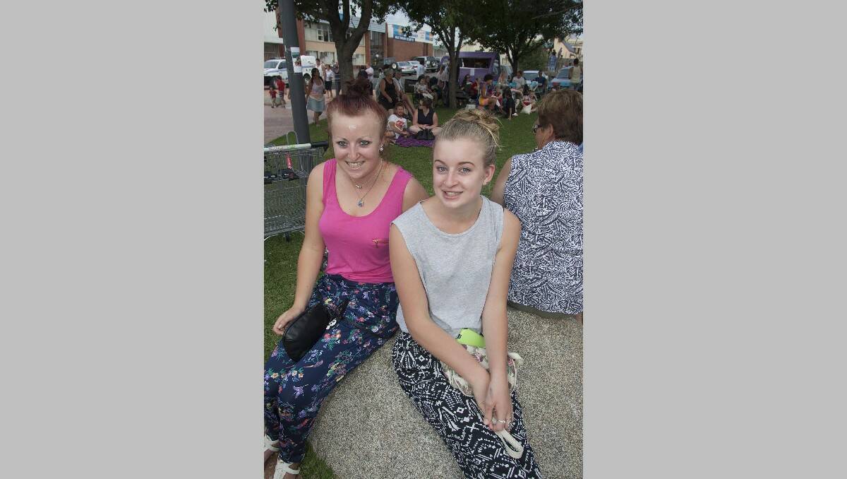 Lily and Meg Warby of Jellat Jellat take in the atmosphere on carols night. 