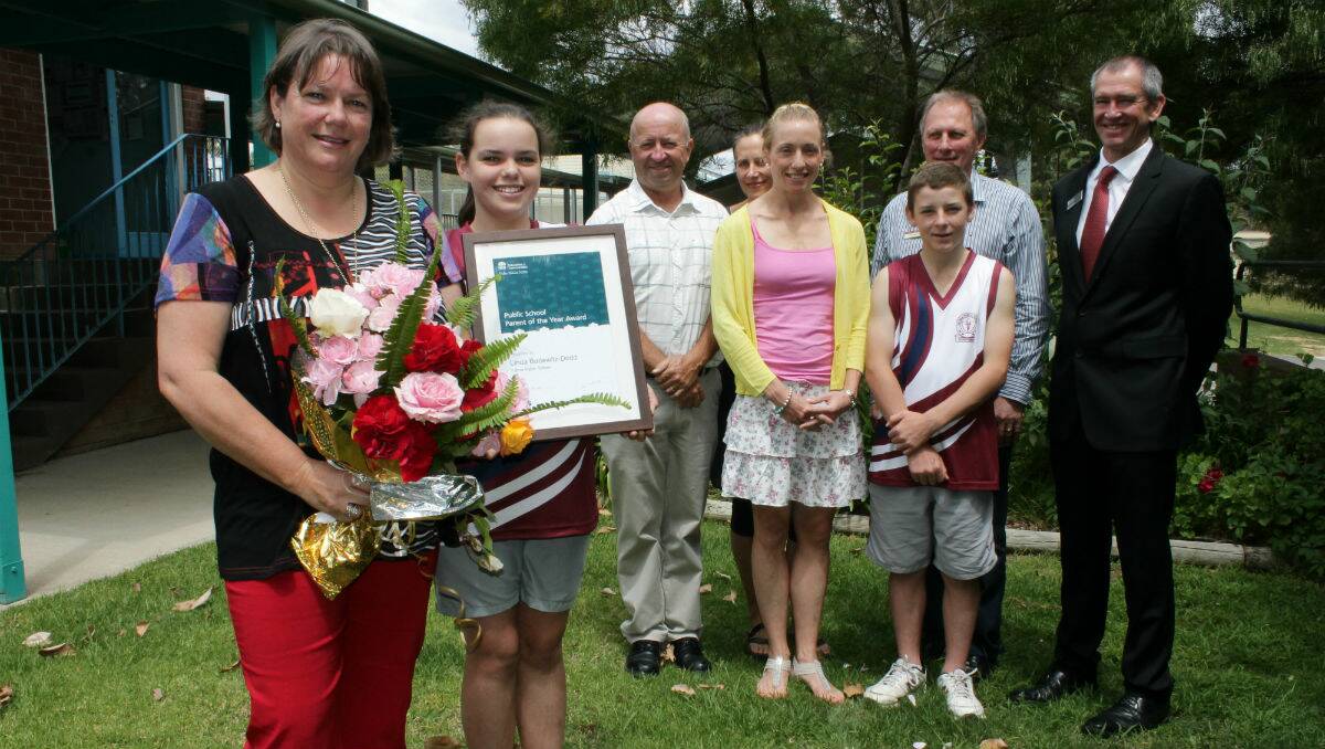 Linda Badewitz-Dodd (left) celebrates being named Public School Parent of the Year with (from left) daughter Mackenzie Dodd, Tathra Public School principal Graham Roberts, Chris Gowing, Kate Whitton, Jacob Scott, Kel Jamieson and Paul Morris.