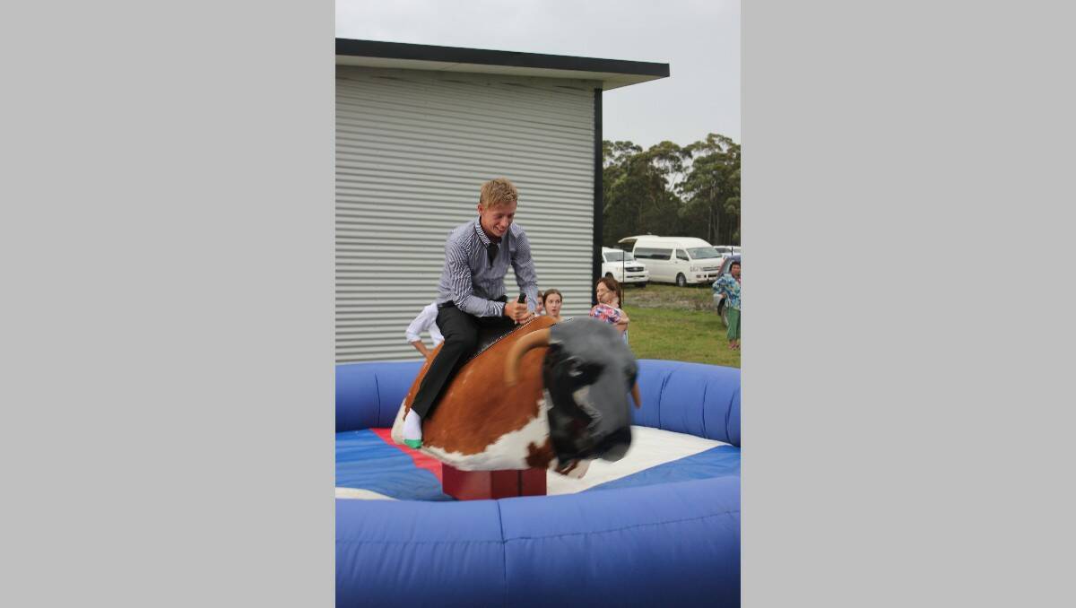 Chris Dwyer takes a turn on the mechanical bull. 