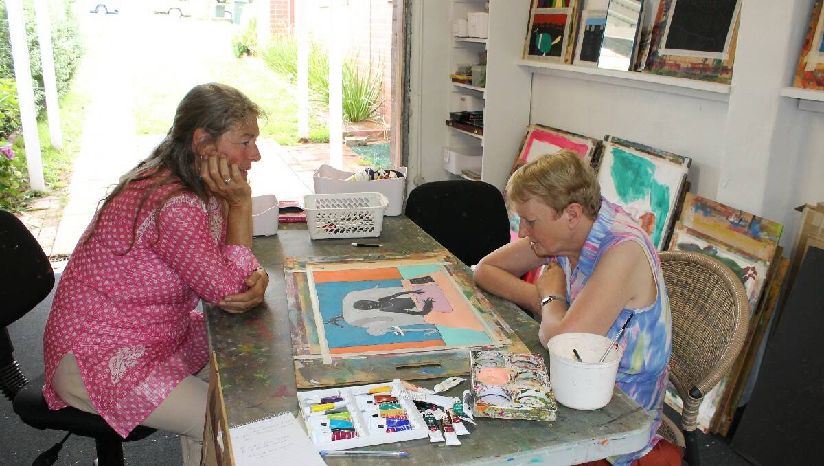 Miriam Kydd (right) discusses colour in her latest work with mentor Annie Franklin.
