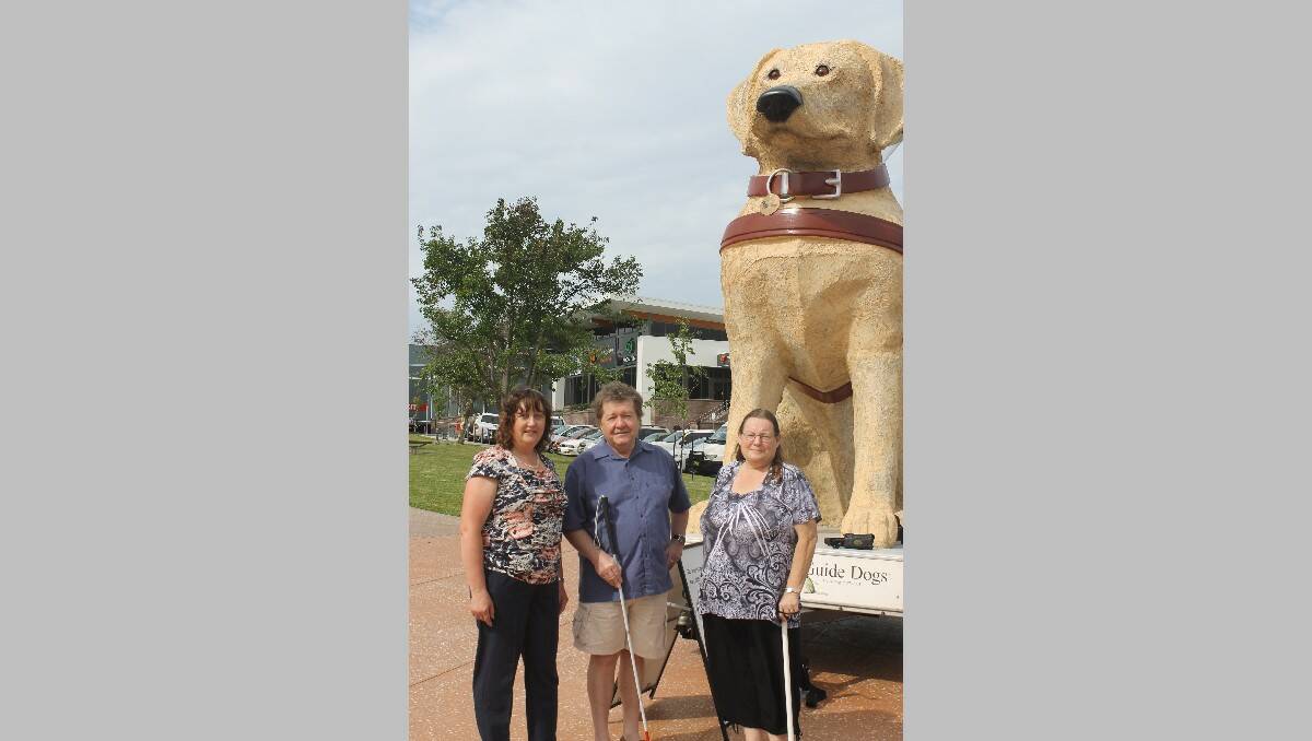 At Littleton Gardens on Wednesday in front of Gulliver, the huge guide dog, are (from left) Judy Hackett, Guide Dogs’ orientation and mobility instructor, Trevor Muller and Fay Smith, both vision impaired.