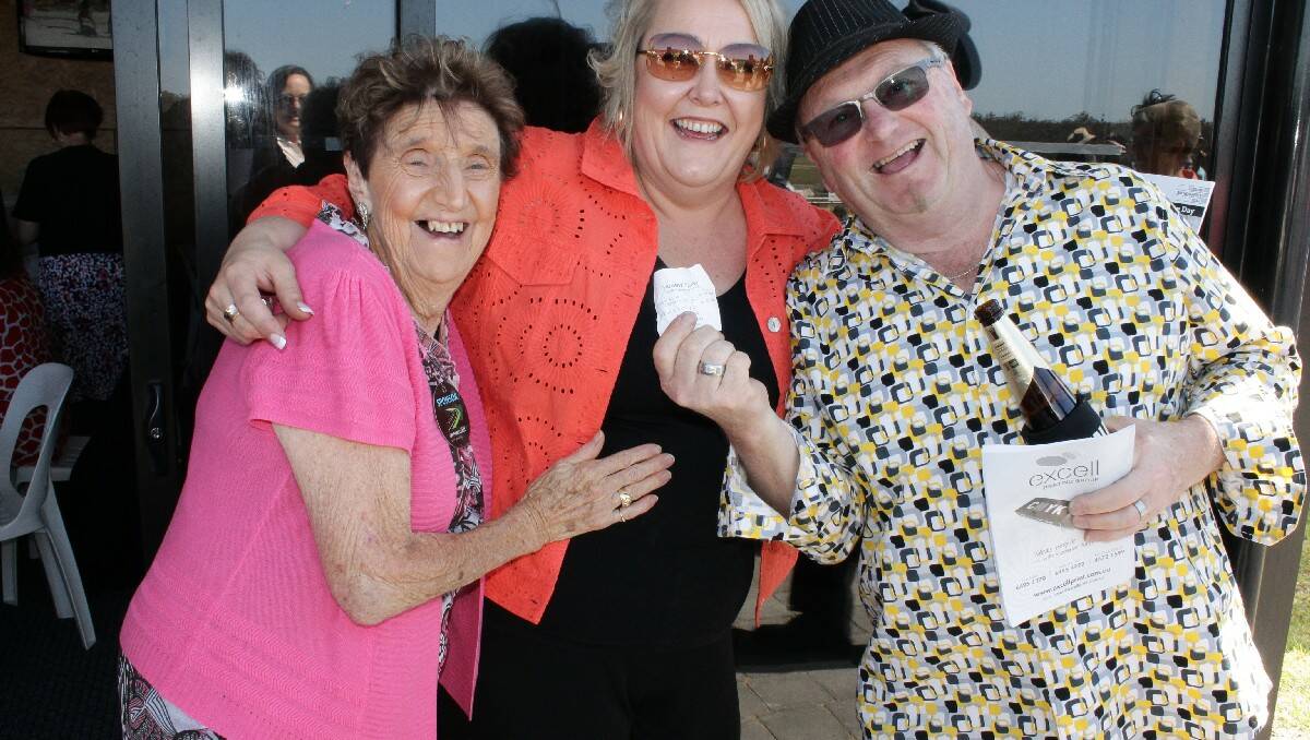 Celebrating their winning bet on Melbourne Cup Day are (from left) Isobel Dixon, Raelene Smith and Graeme Dixon, of Bega.