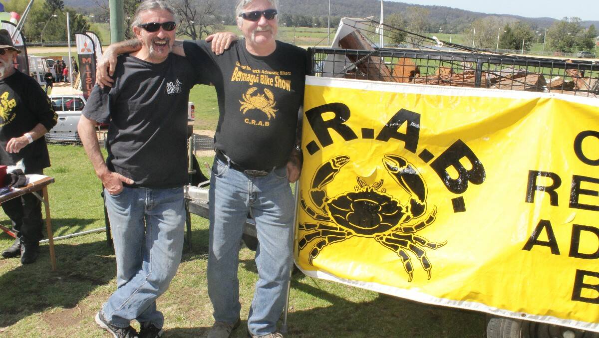 Bermagui CRABS members Gavin Martin and Robert Graham run a fundraising raffle for firewood.