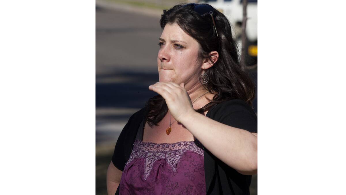 Zoe Zanelli of Candelo is brought to tears by the trees’ removal. Photo: Peter Smith.