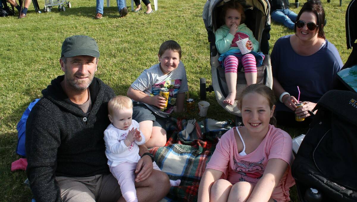 Adam and Donna Matheson, with their children (from left) Piper, Zade, Lottie and Ava, visit the Kalaru race track from Warrnambool.