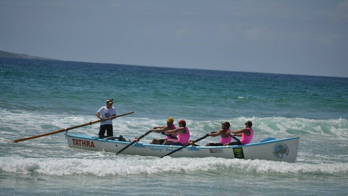 Tathra's men's veteran team heads to the beach in second place during the third leg of he George Bass Surfboat Marathon.