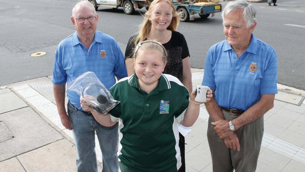 Sapphire Coast Anglican College pupil Kathleen Angove shows off her new hearing aid technology to (from left) Sam Warren, her mum Danielle Angove and Peter Wiley.