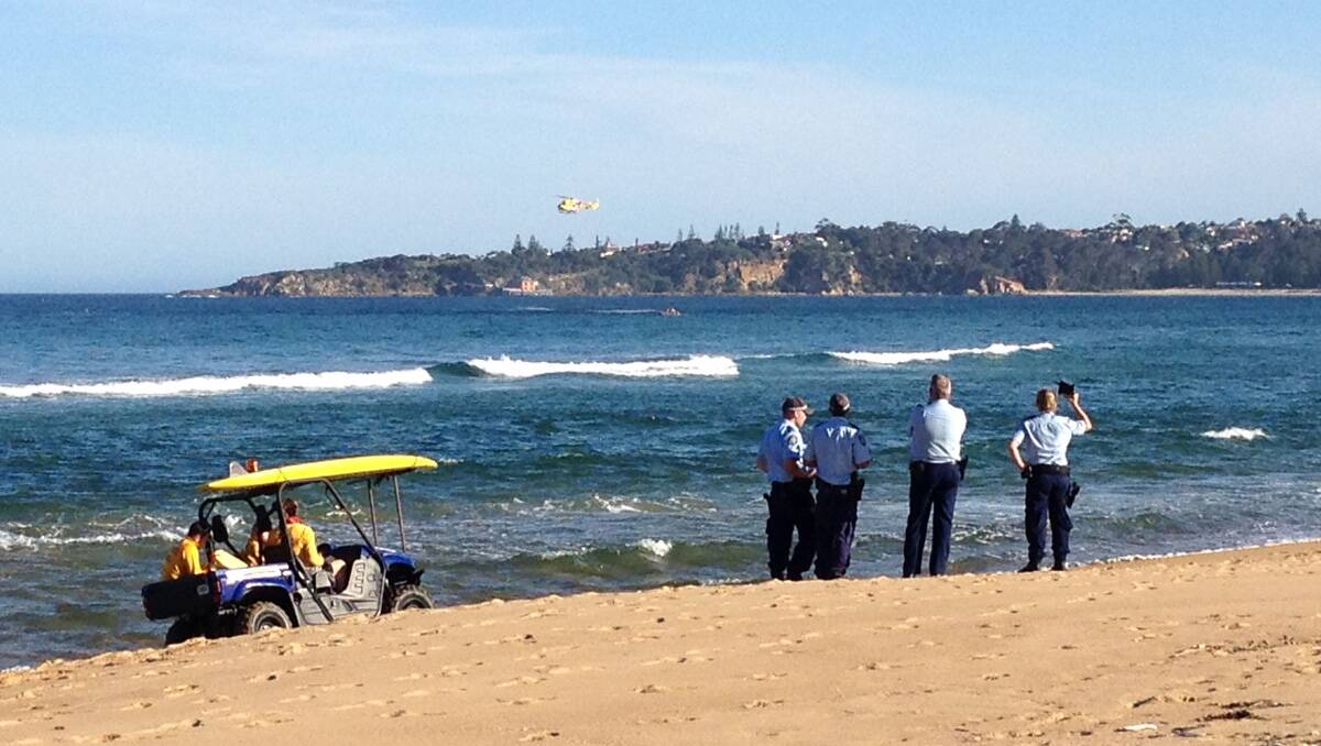 Surf lifesavers, police and other emergency personnel conduct a search operation near Tathra.